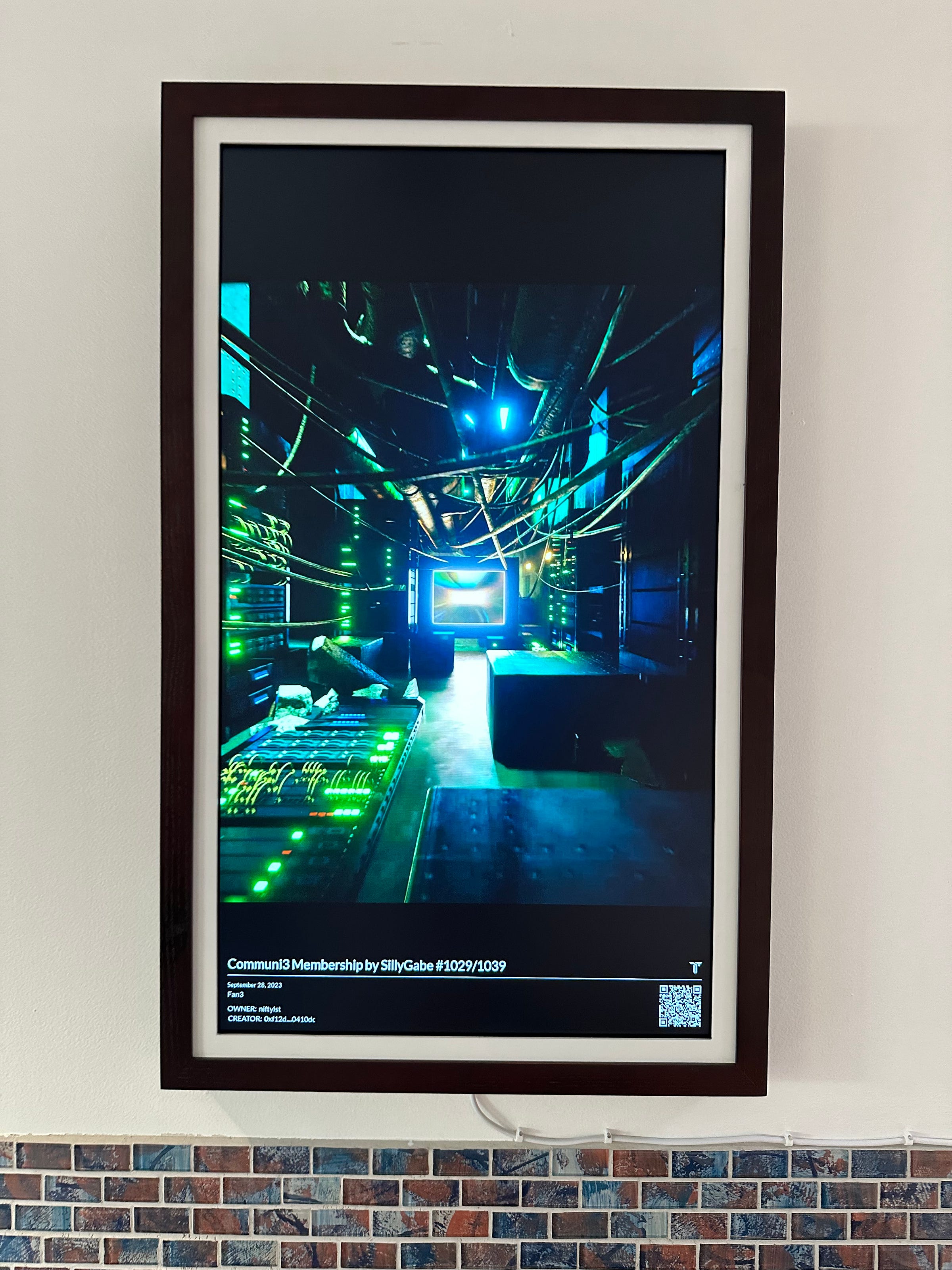 A TokenFrame in portrait mode on a wall